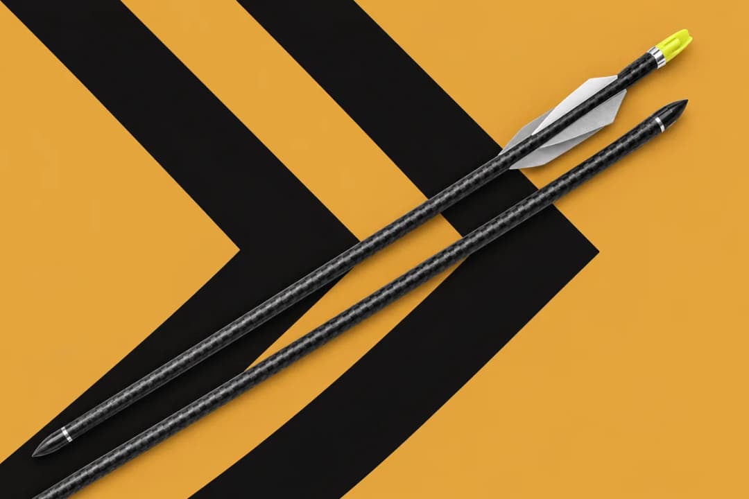 Carbon bolts on gold chevrons Two black carbon bolts lying on a diagonal over a gold background with bold black chevron stripes, one with white vanes and a lime-yellow nock