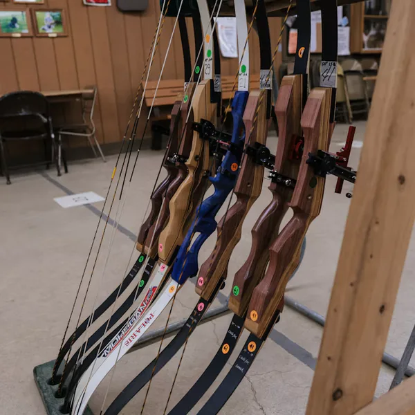 Recurve bows on a rack in an archery shop